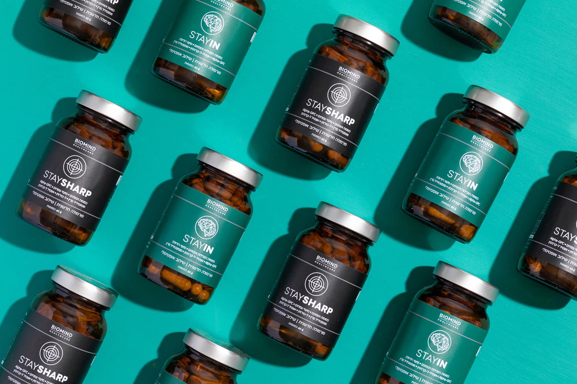 Biomind supplement bottles on a teal background